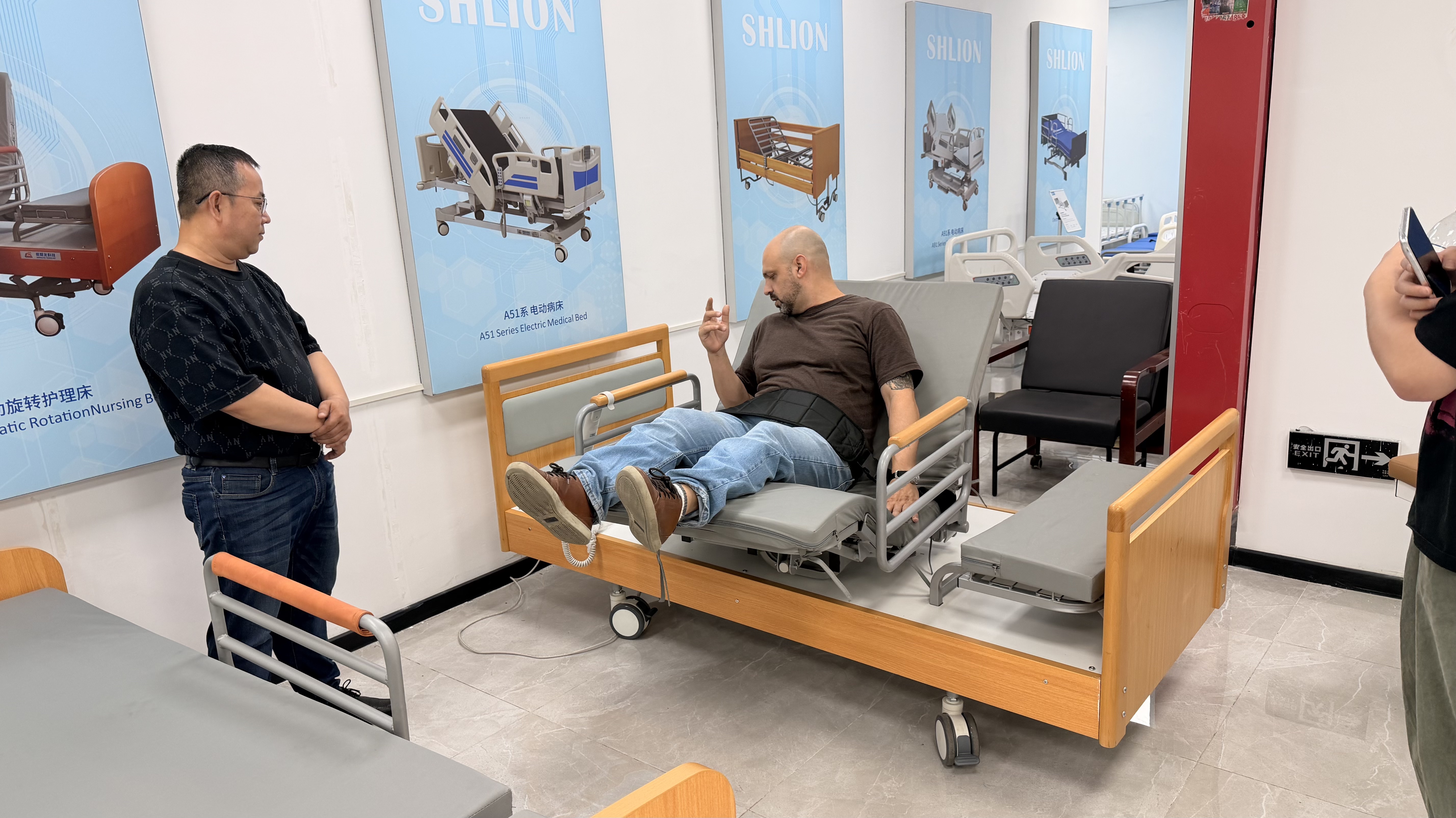 Customer testing a SHLION home care bed