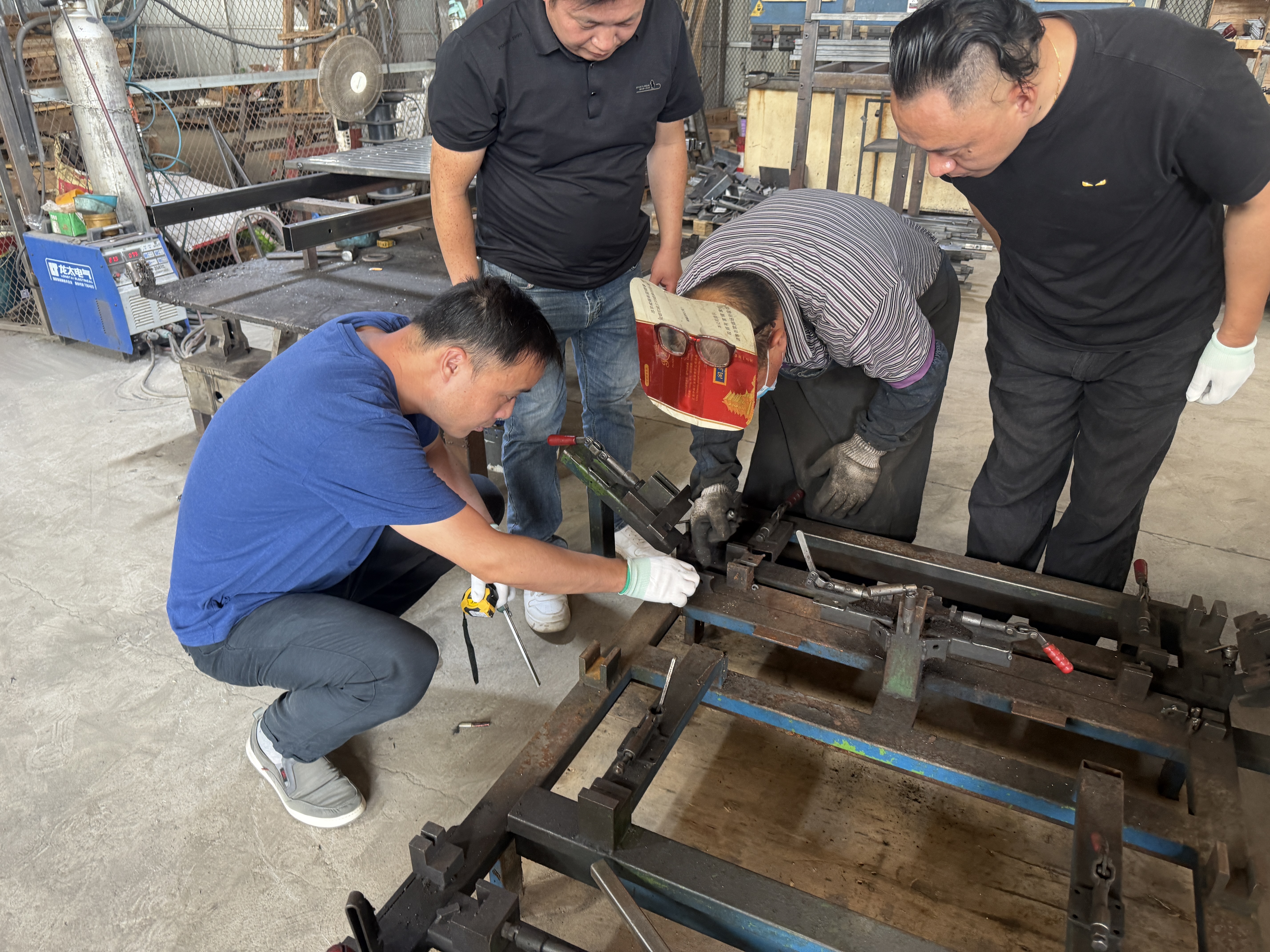 UK customer inspecting a SHLION welding fixture
